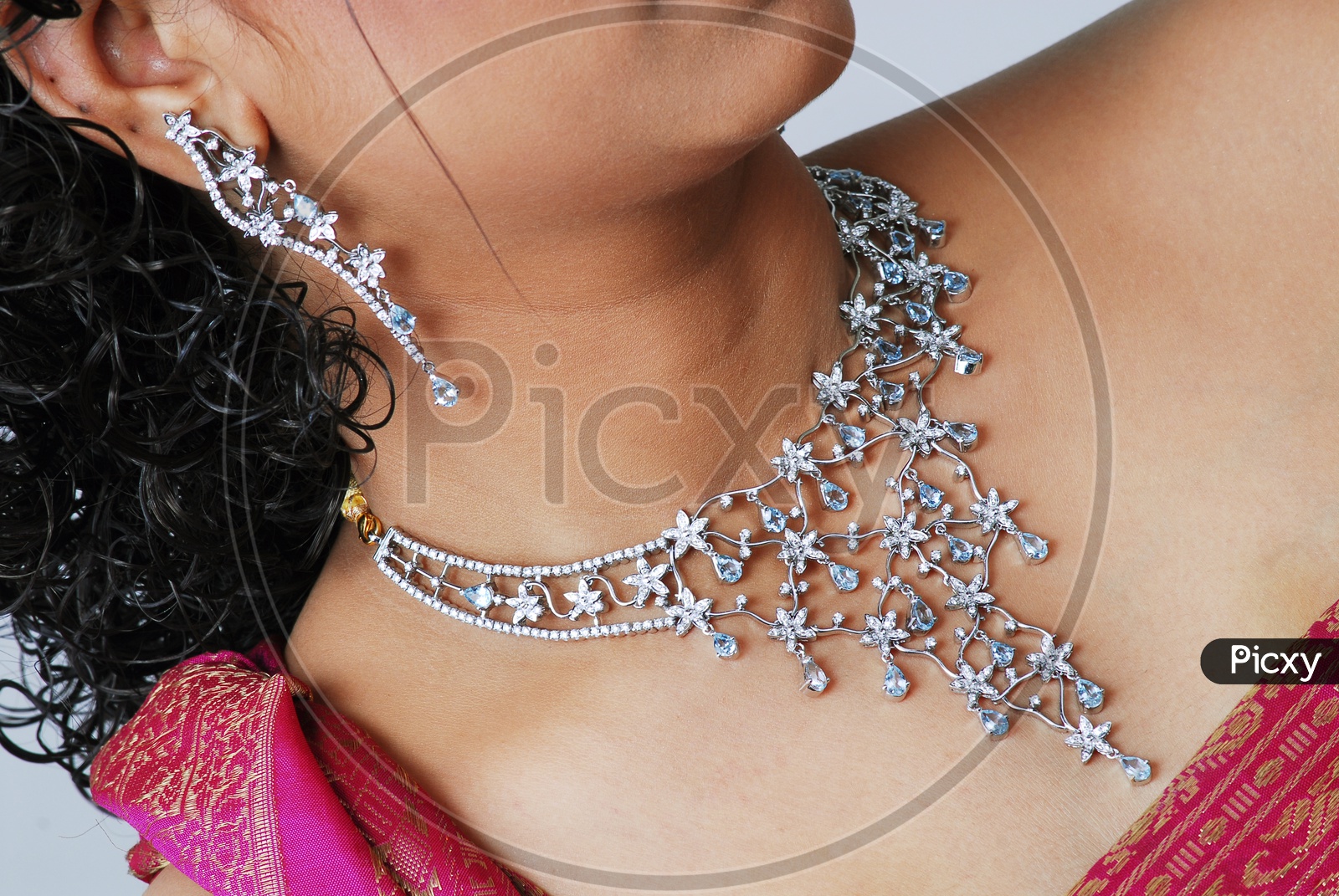 Close up shot of necklace on women's neck