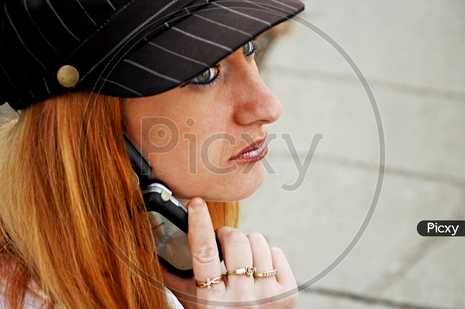 A blonde woman talking over the phone