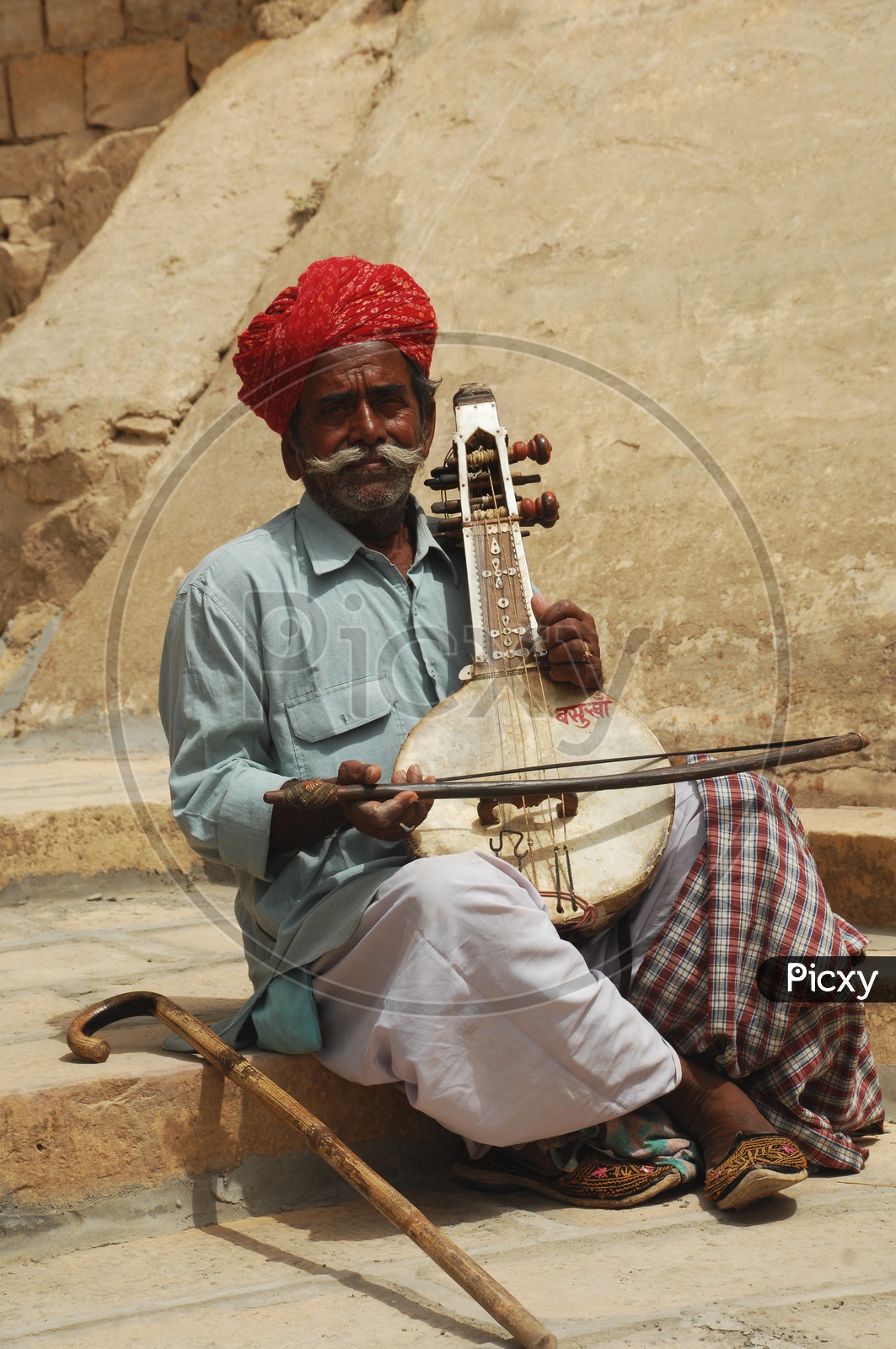 Rajasthani Men playing musical instrument