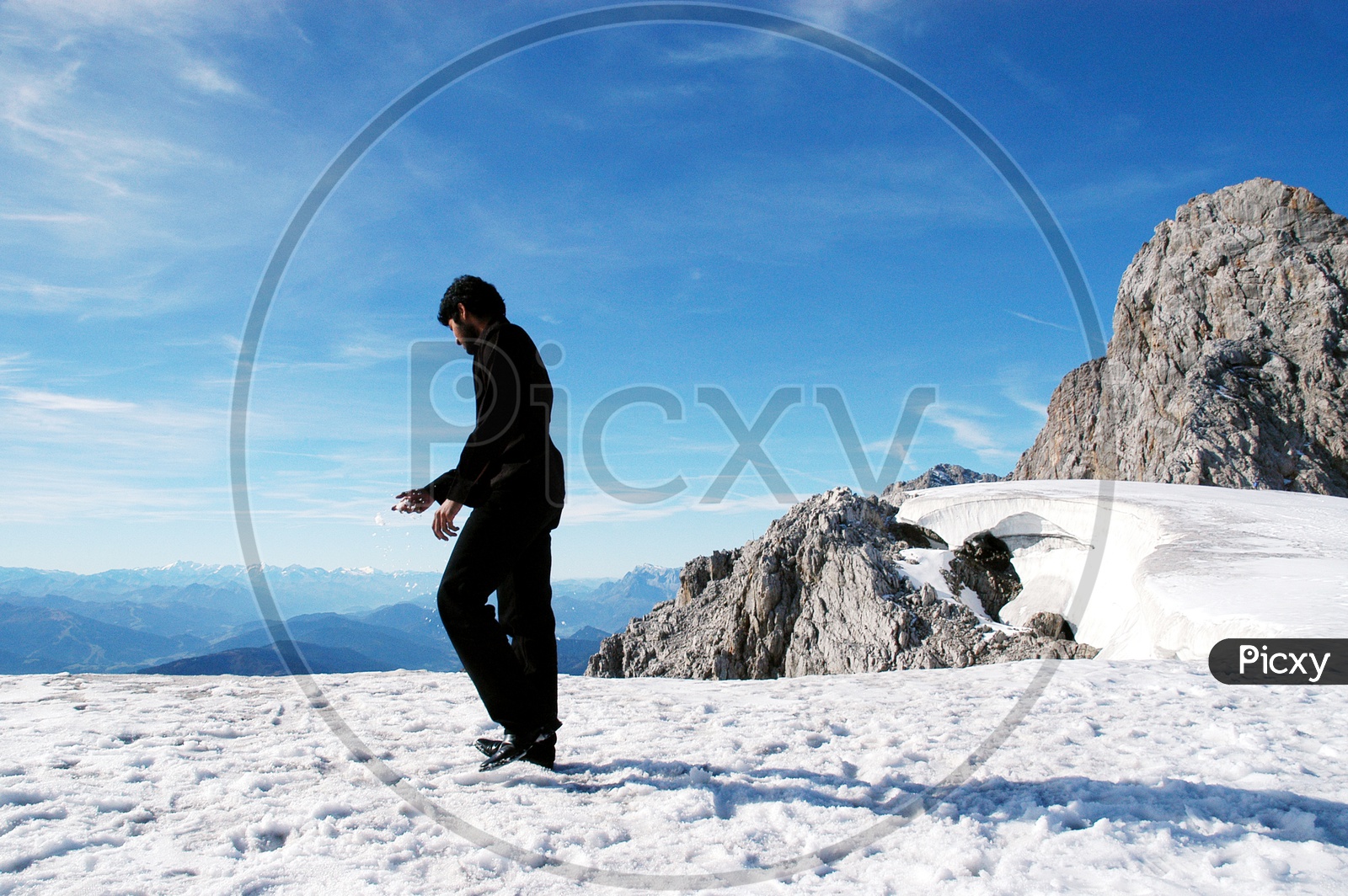 Man standing on top of the Hoher Dachstein Mountain