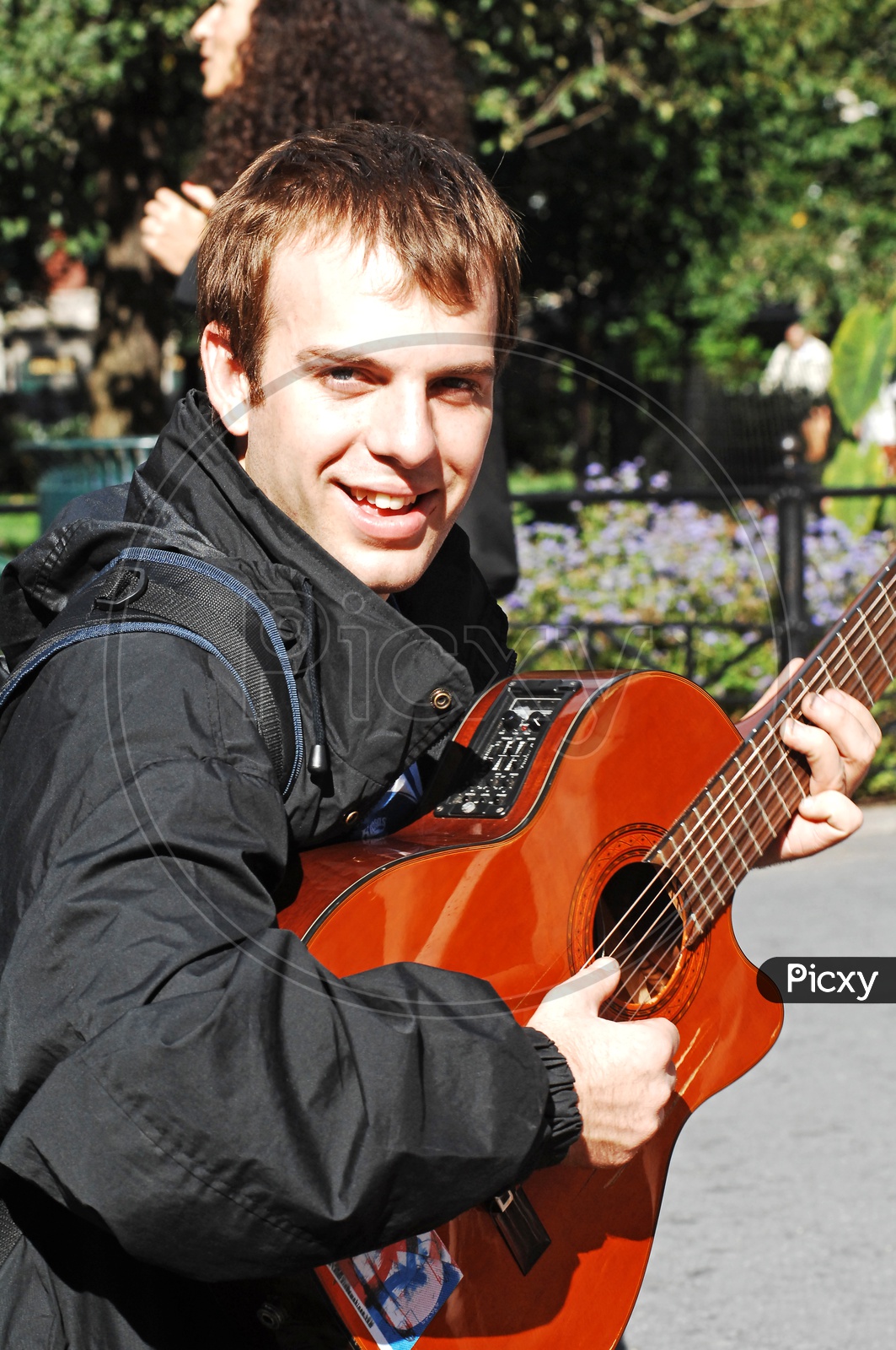 A foreigner playing guitar
