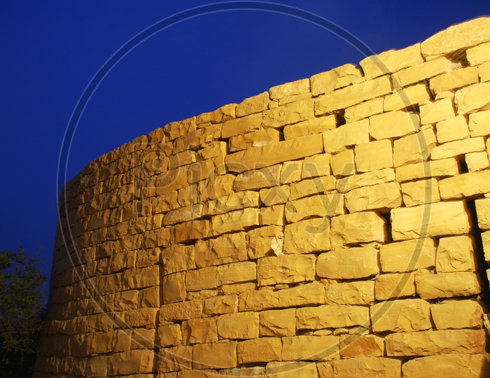 A yellow rock wall