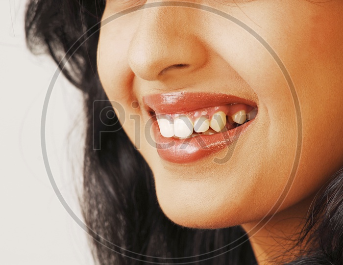 Indian woman smiling wearing lipstick