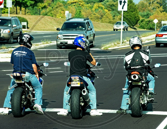 Motorcycle Riders at a Red Signal
