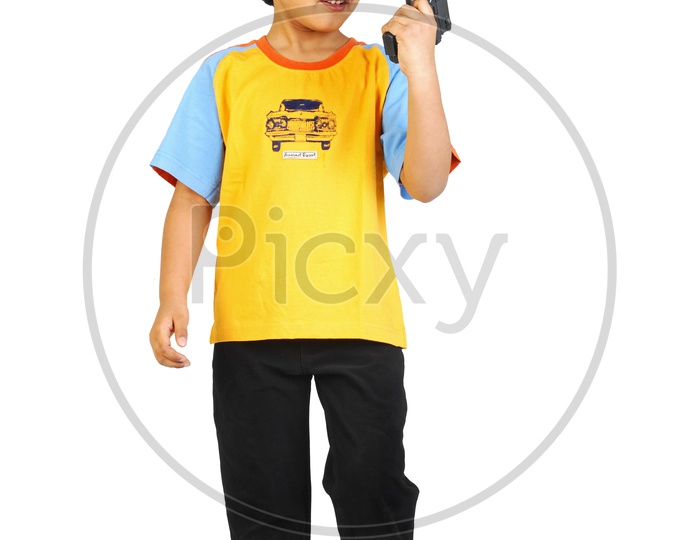An Indian boy with specs and toy gun in hand - white background