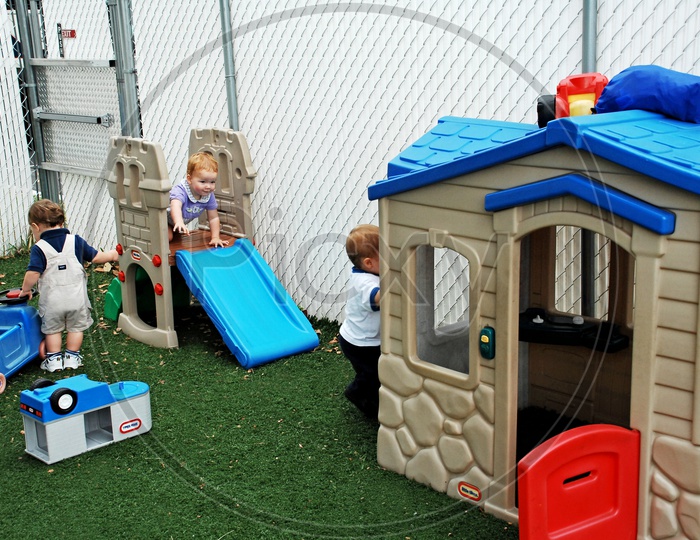 Toddlers playing in the play area