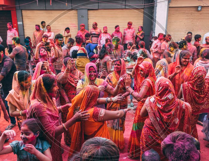 ladies celebrating holi by dancing on traditional songs