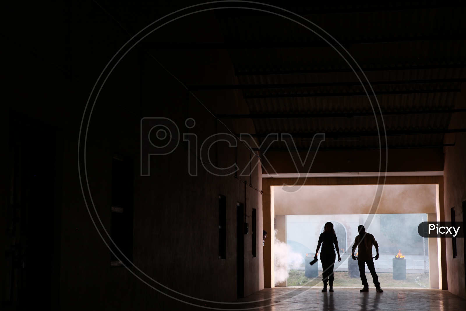 Silhouette Of People in a Corridor