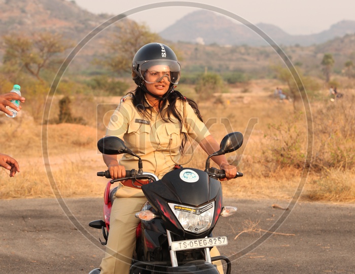 Image of Woman Or Lady Police Driving Bike-CD996090-Picxy