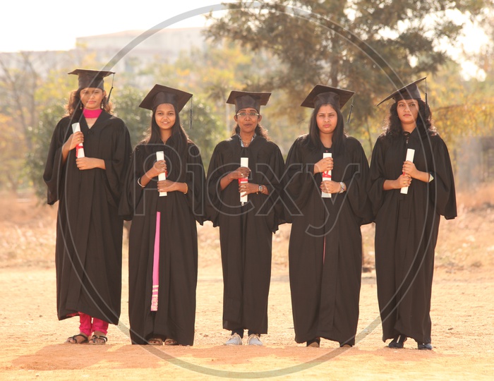 Indian Young Girls Wearing Graduation Dresses
