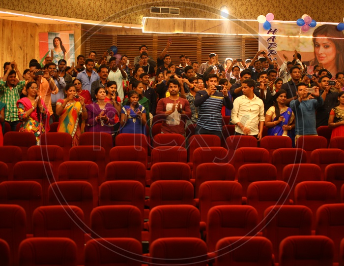 Crowd In an Auditorium Taking Pictures With  Their Smart Phones