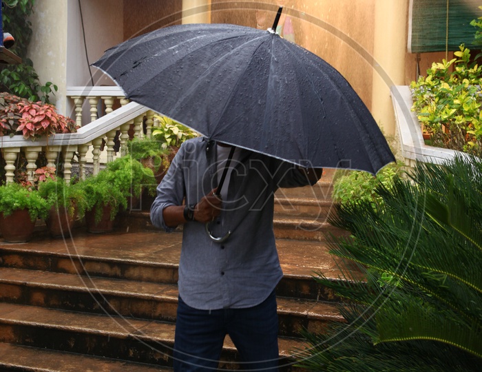 A Man Under an Umbrella