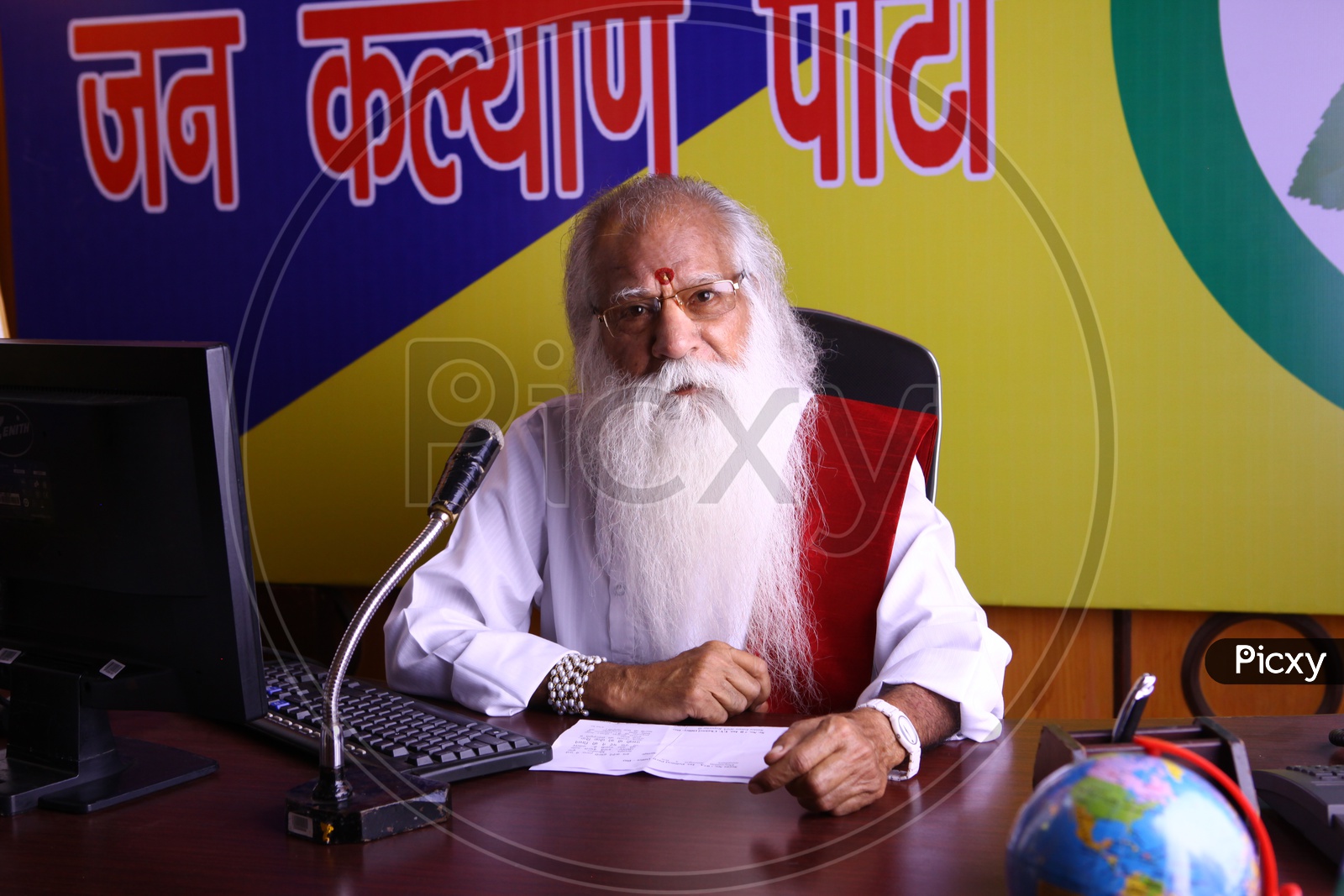 An old Man Or Political Party Leader Speaking In a Party Office