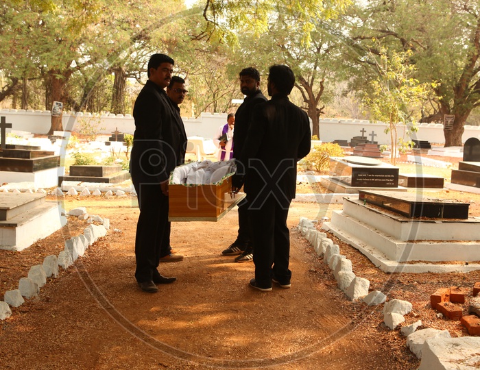 Men Carrying Funeral Box Or Coffin Box