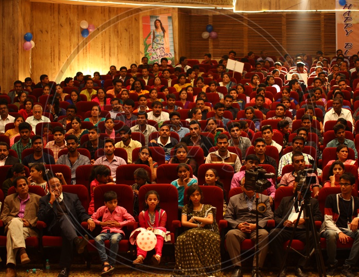 Invities and Media People In a Auditorium