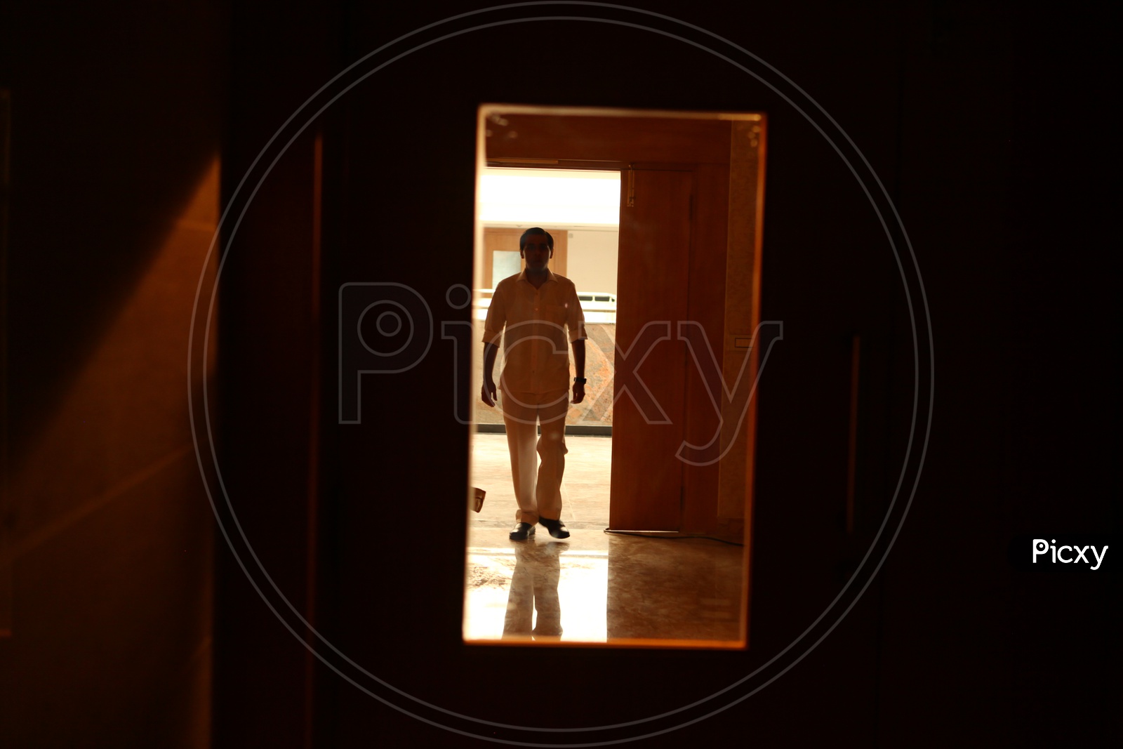 Silhouette of a Man at a Hospital Corridor