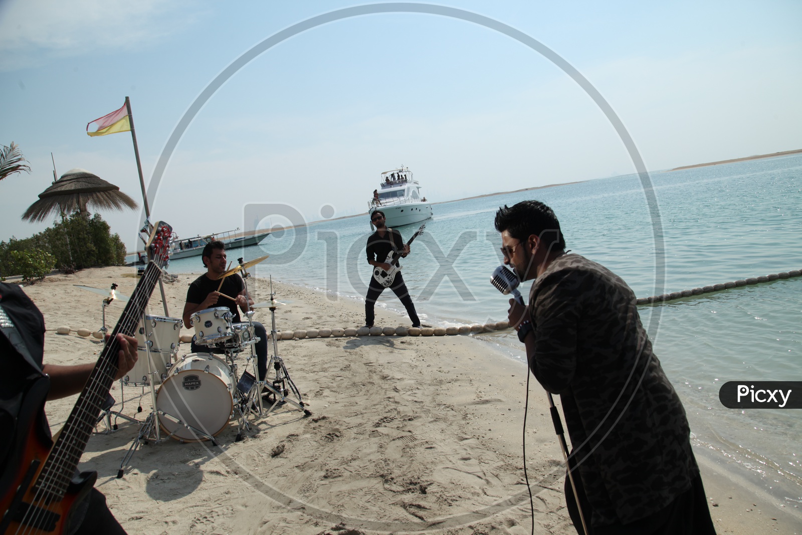 Music Band Performing On a Beach