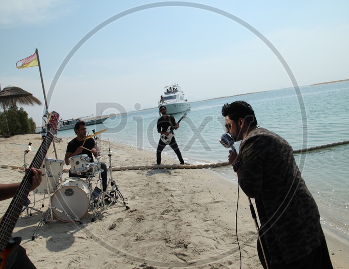 Music Band Performing On a Beach
