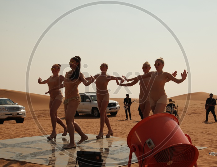 Belly Dancers Performing on Desert Sand Dunes For a Music Album