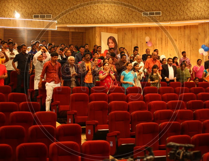 Crowd In an Auditorium Taking Pictures With  Their Smart Phones