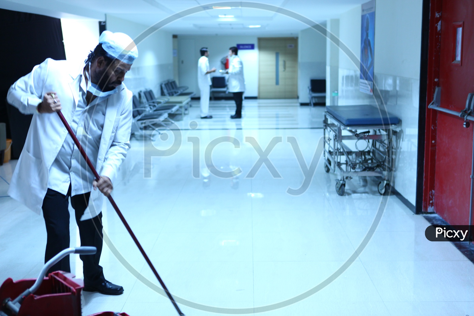 Hospital Staff Cleaning The Floor in a Hospital