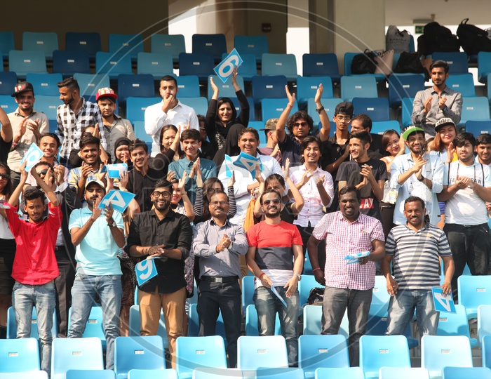 Crowd Cheering From Stands in a Cricket Stadium