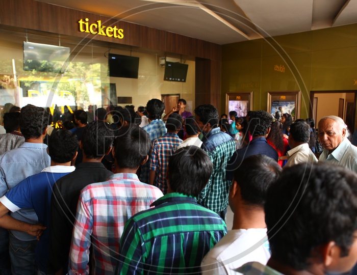 Crowd At Ticket Counter In a Movie Theater