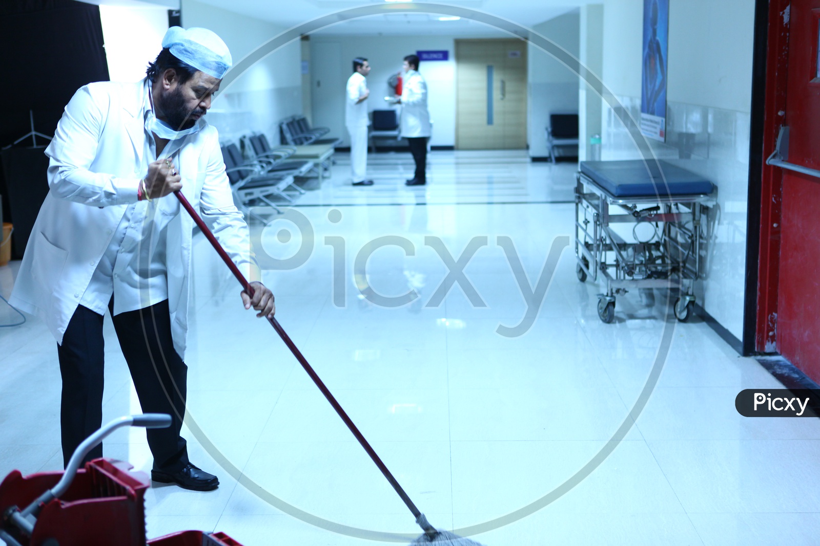 A Doctor Cleaning The Floor In Hospital
