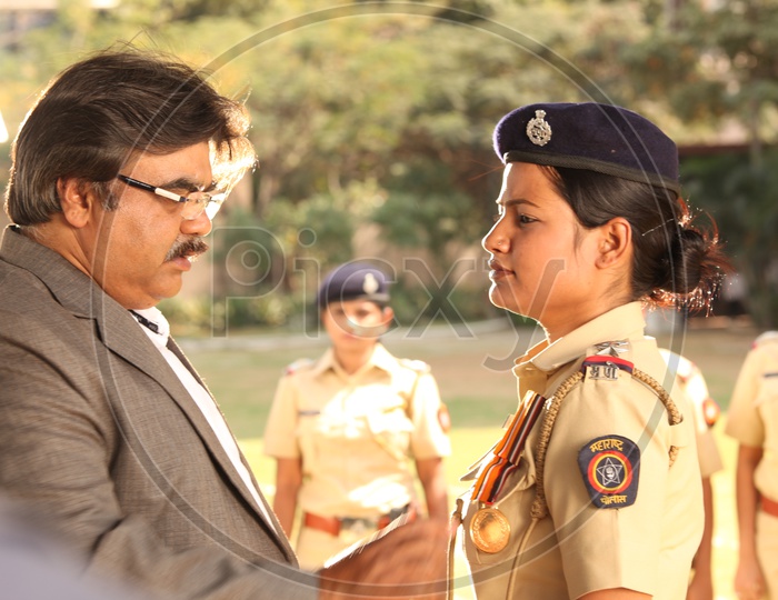 Indian Woman or Lady  Police Receiving Gallantry From Officers