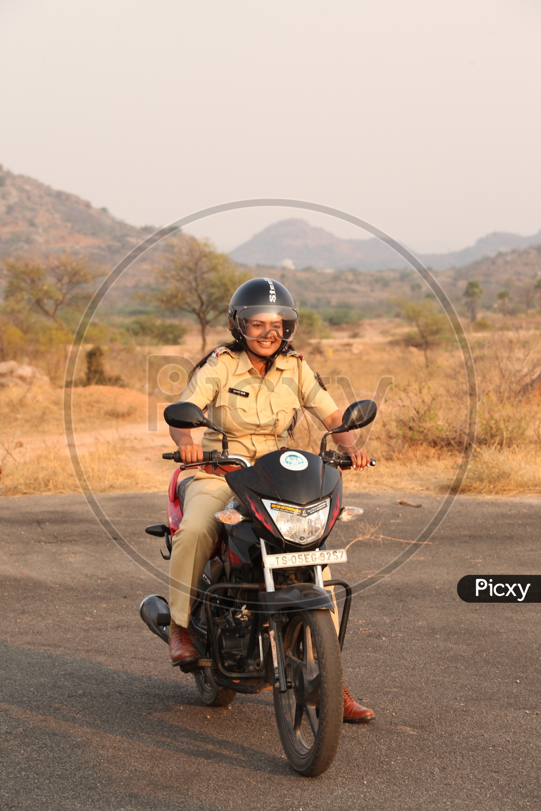 Woman Or Lady Police Driving Bike