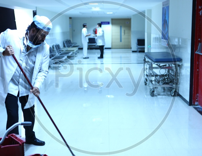 Hospital Staff Cleaning The Floor in a Hospital