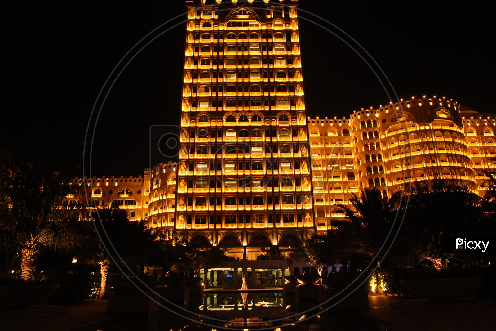 A Building Facade With Gold Luminous Lights