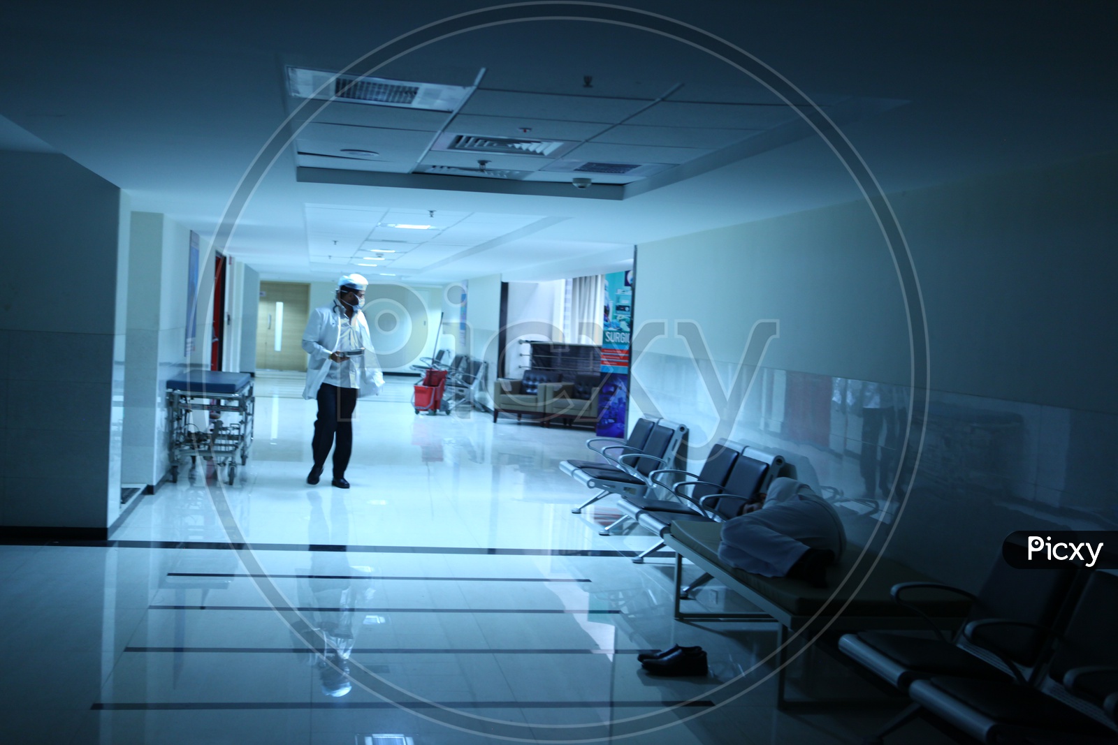 A Doctor Walking on a Hospital Corridor