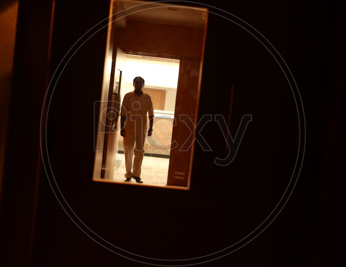 Silhouette of a Man at a Hospital Corridor