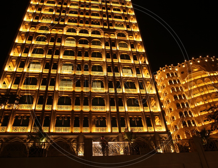 A Building Facade With Gold Luminous Lights