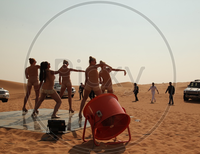 Belly Dancers Performing on Desert Sand Dunes For a Music Album