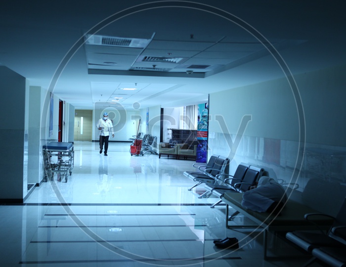 A Doctor Walking on a Hospital Corridor