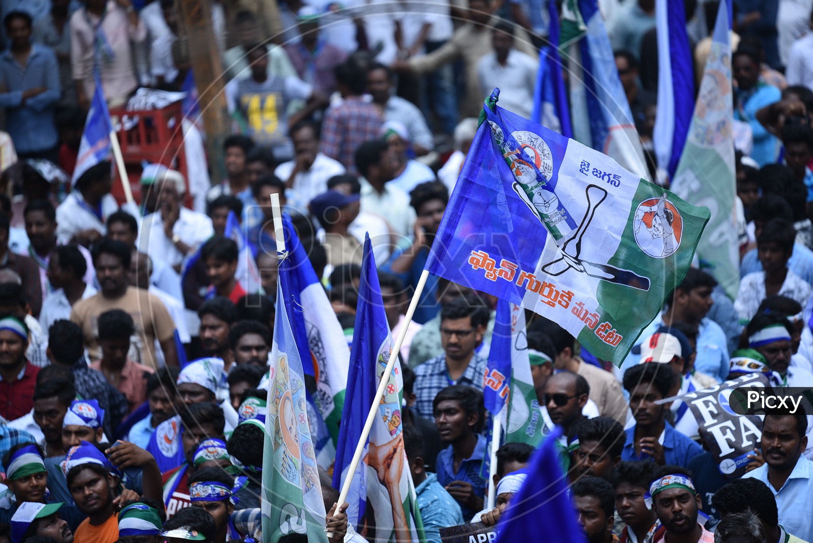 YSRCP Party Supporters With Party Flags   During  Election Campaign Rally