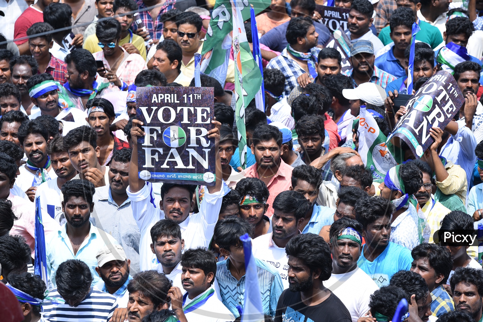YSRCP Party Supporters With Vote For Jagan Placards During Election Campaign Rally