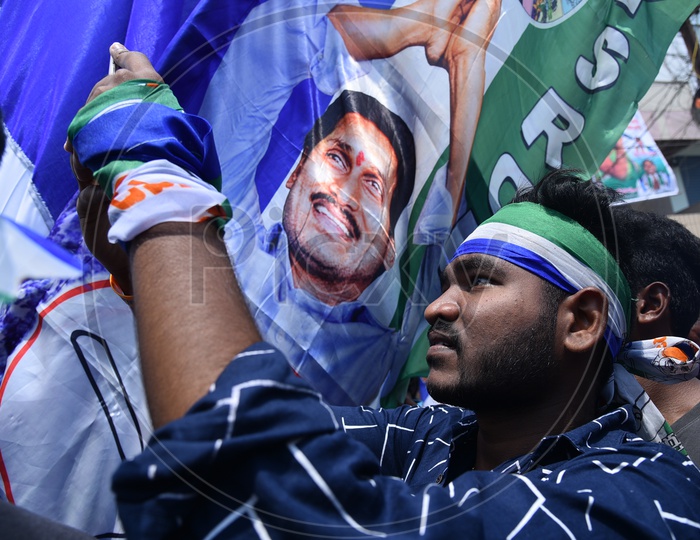 A YSRCP Party Supporter Taking Pictures During Election Rally