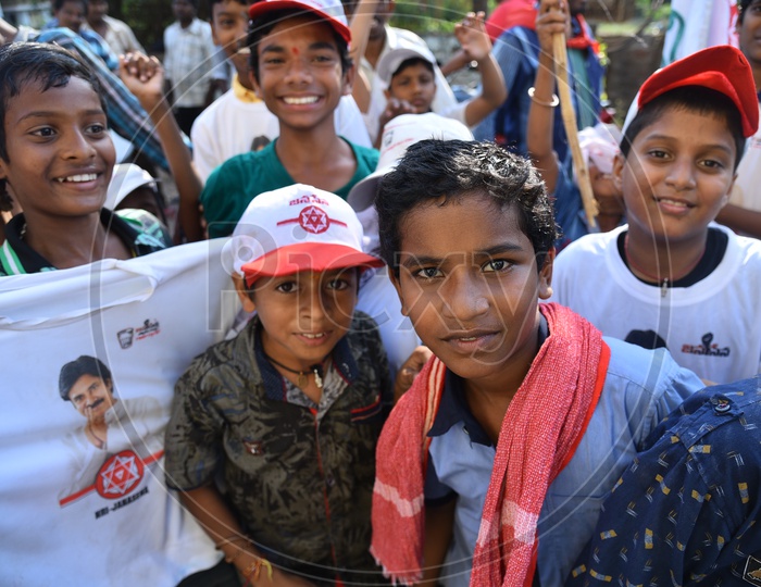Kids Supporting Janasena Party By Wearing Caps and Holding Flags During Election Campaign Rally