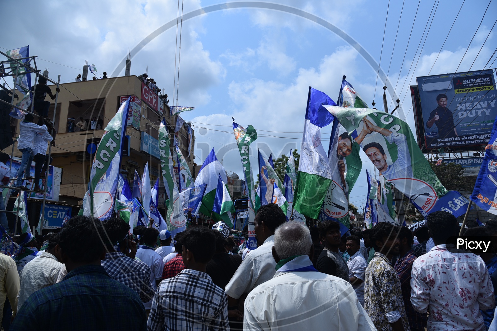YSRCP Party Supporters With Party Flags  During Election Campaign Rallies