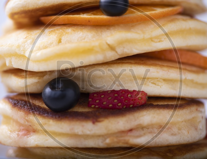 Pancake Stack With Strawberry , Blueberry and Orange