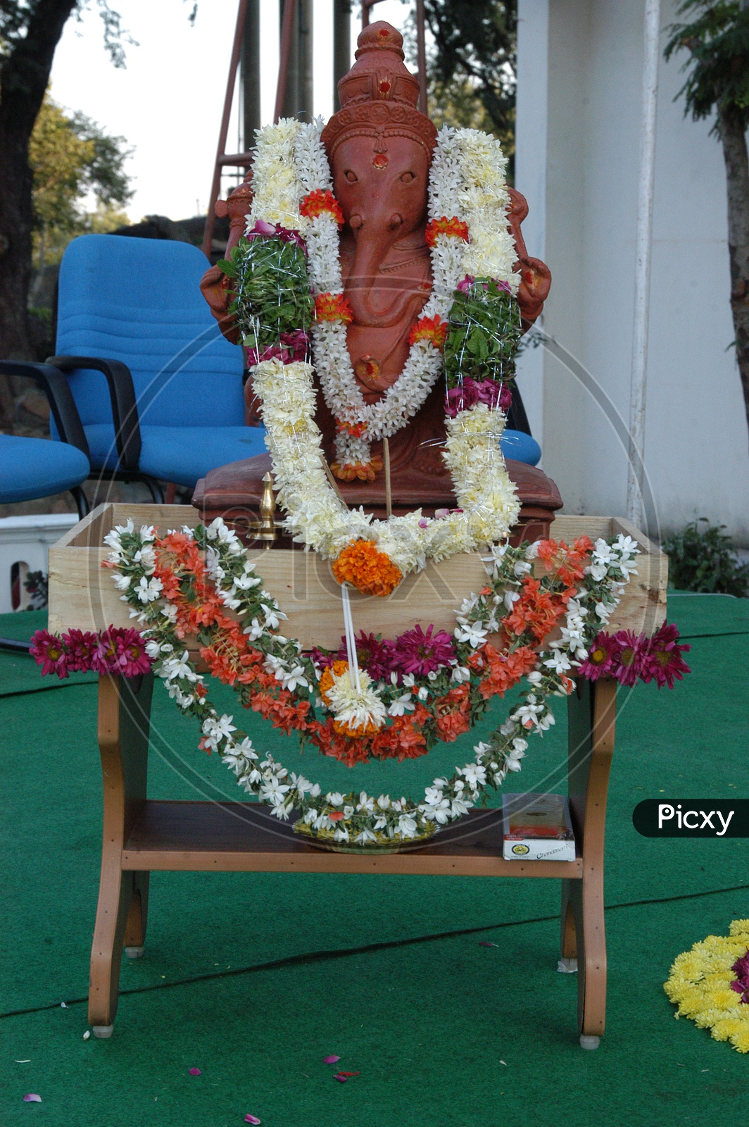 Lord Ganesha Statue decorated with garlands
