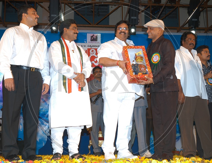 Dasari Narayana Rao awarding a memento to AVS