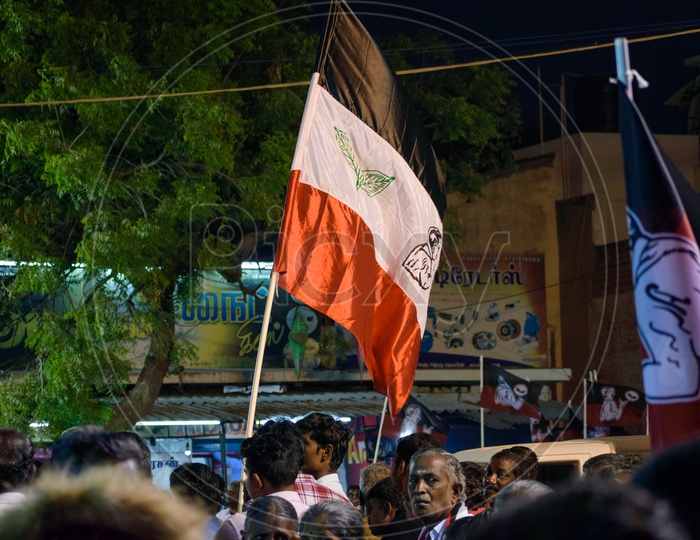ADMK cadre  holding the ADMK Flag