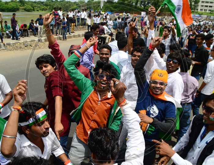 Young Indian People Waving  Indian National Flag ( Tri-Color ) Celebrating Independence Day