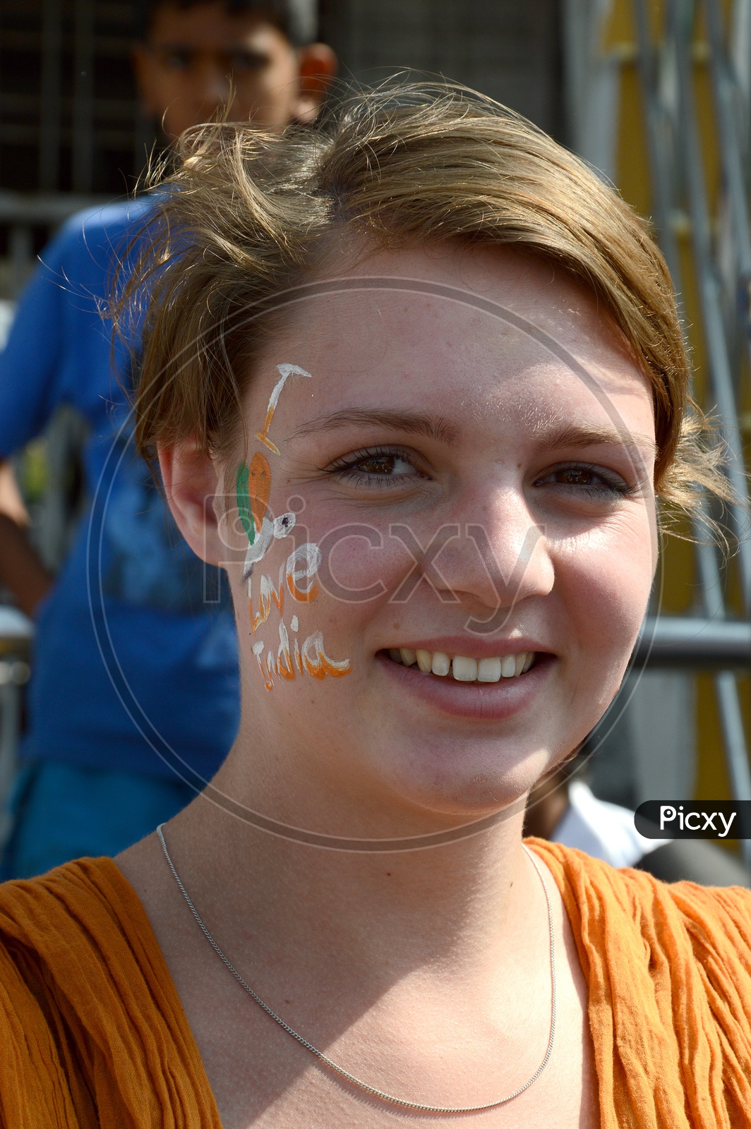 A Foreign Lady  Pasting Indian National Tri-Colors On the Cheek Celebrating Independence Day
