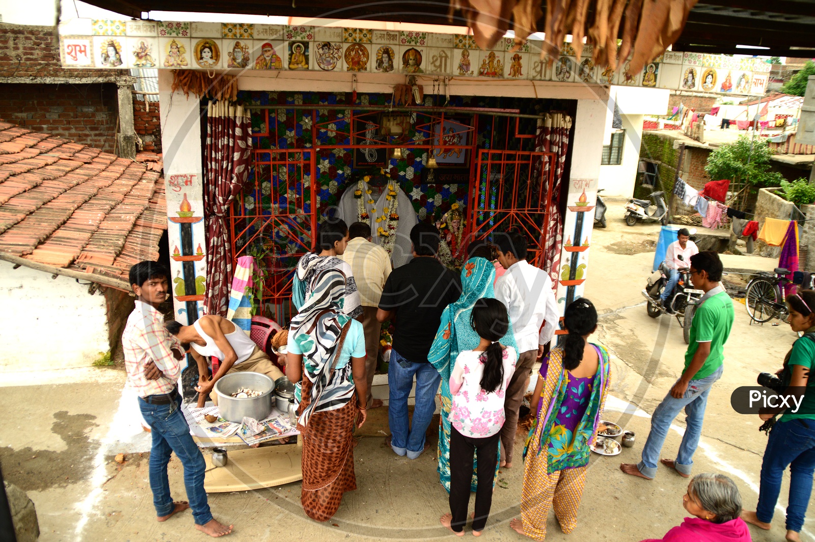 Devotees offering prayers to snake god