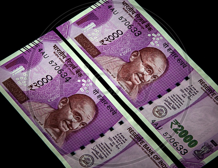 Indian New Currency Note Of 2000 Rupees On An Isolated Black  Background